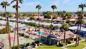 Aerial view of an Arizona manufactured home community with palm trees around it
